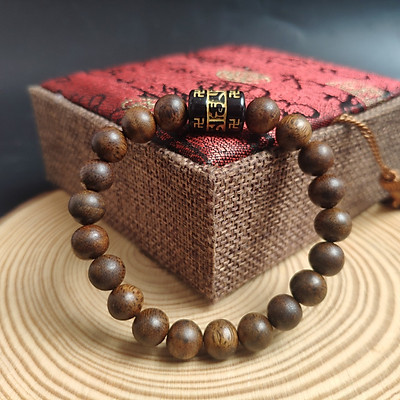 vòng trầm hương đính charm lư thống om mani